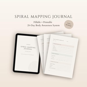 May include: A digital tablet and several printed pages of a journal. The tablet displays the title "SPIRAL MAPPING JOURNAL" and the printed pages include the text "DAILY BODY CHECK-IN". The journal is a 2-in-1 bundle.