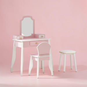 May include: A pink and white wooden vanity set with a matching chair and stool. The vanity has a mirror, two small drawers, and a larger drawer. The chair has a curved back, and the stool has a white seat with a gold trim.