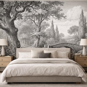 May include: A bedroom with a large bed and neutral-toned bedding. The wall features a black and white mural of a classical landscape with trees and a bridge. Two wooden bedside tables with lamps are positioned on either side of the bed.