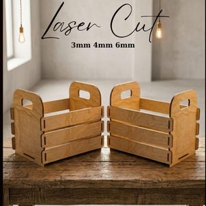 May include: Two light-colored wooden crates with open-slat sides and integrated handle cutouts in the end panels. The text Laser Cut 3mm 4mm 6mm and DIGITAL FILE Instant Download is visible in the image, indicating a digital design file.
