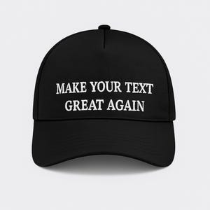May include: Black baseball cap with a curved brim. The cap features white embroidered text that reads "MAKE YOUR TEXT GREAT AGAIN". The hat is a classic style, suitable for various casual outfits.