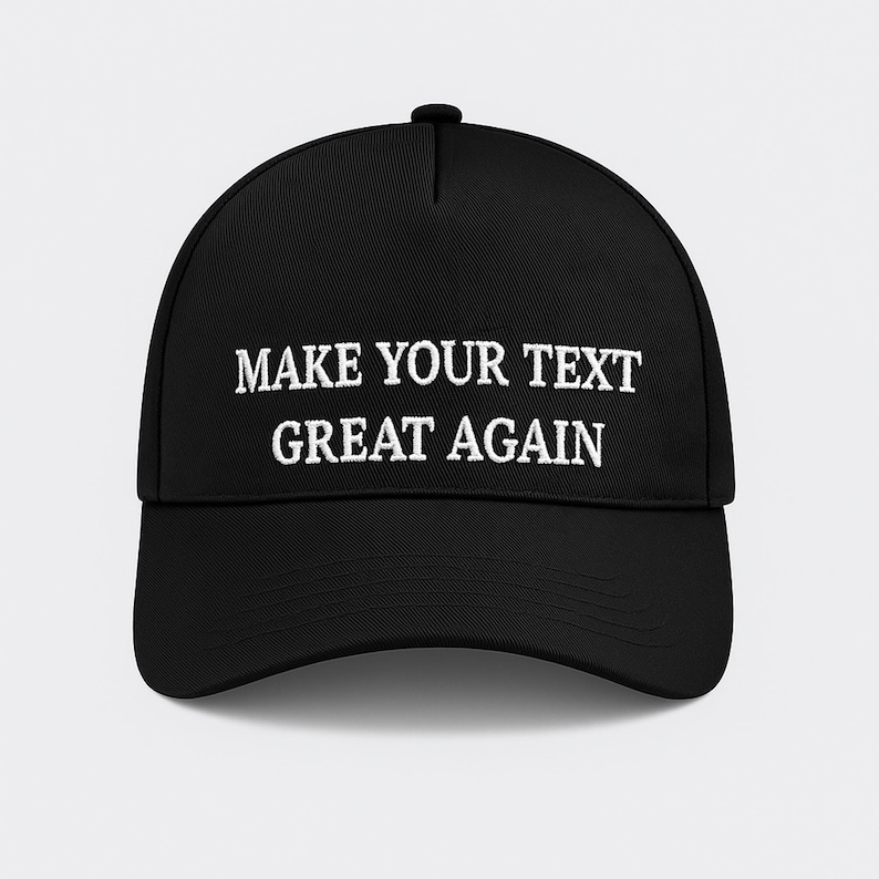 May include: Black baseball cap with a curved brim. The cap features white embroidered text that reads "MAKE YOUR TEXT GREAT AGAIN". The hat is a classic style, suitable for various casual outfits.