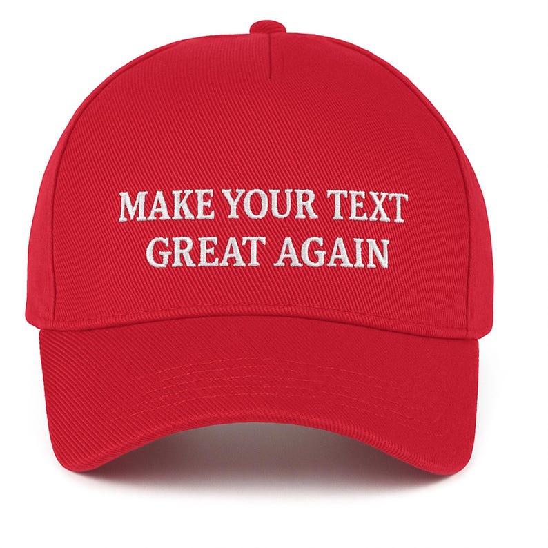May include: A red baseball cap with a curved brim and a button on top. The cap features white embroidered text that reads "MAKE YOUR TEXT GREAT AGAIN". The hat is made of a textured fabric.