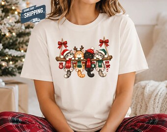 Christmas Kittens Shirt, Cute Hanging Cats Santa Hat Christmas Tee, Cozy Scarf Kitten Xmas T-Shirt, Cat Mom Shirt, Cat Lover Gift for Women