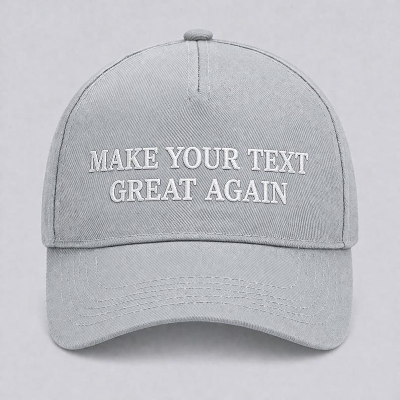 May include: A light gray baseball cap with the embroidered text "MAKE YOUR TEXT GREAT AGAIN" in white. The cap has a curved brim and a button on top. The hat is made of a durable fabric.