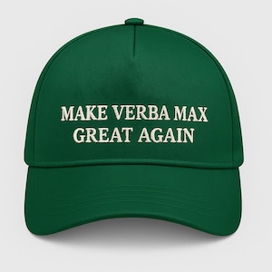 May include: A green baseball cap with the embroidered text "MAKE VERBA MAX GREAT AGAIN" in white. The cap has a curved brim and a button on top.