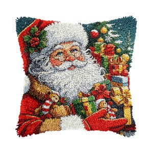 May include: A square throw pillow featuring a textured punch needle design of Santa Claus with a white beard, red hat, and red mittens. Santa is holding wrapped gifts and toys against a dark teal background with a decorated Christmas tree.