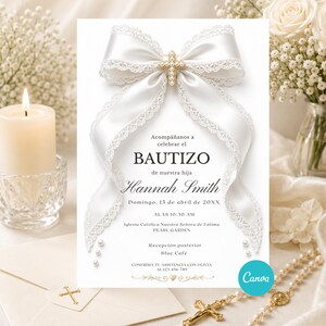 May include: A white baptism invitation card with a large satin bow and a gold cross. The card includes the text "BAUTIZO" and "Hannah Smith". A candle and flowers are in the background.