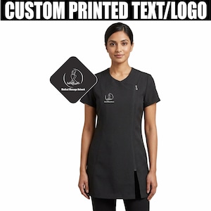 May include: Black uniform top with a diagonal zip and short sleeves. The top features a small logo on the chest and a larger logo on a black square. The text "CUSTOM PRINTED TEXT/LOGO" is at the top.