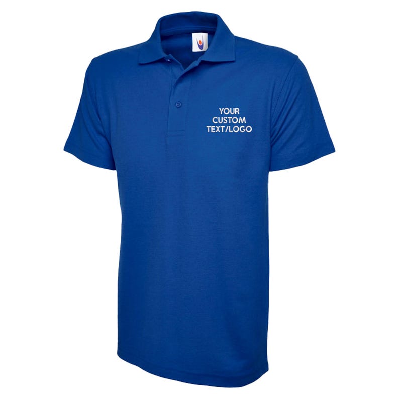 May include: A royal blue polo shirt with a collar and short sleeves. The shirt has a three-button placket and the text "YOUR CUSTOM TEXT/LOGO" printed in white on the chest. The shirt is made of a smooth, likely synthetic fabric.