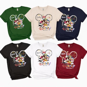 May include: Six short-sleeved t-shirts in various colours, including green, cream, navy, black, white, and burgundy. Each shirt features a Disney-themed graphic with a name, Mickey Mouse ears, and the text "Disney Trip 2024."