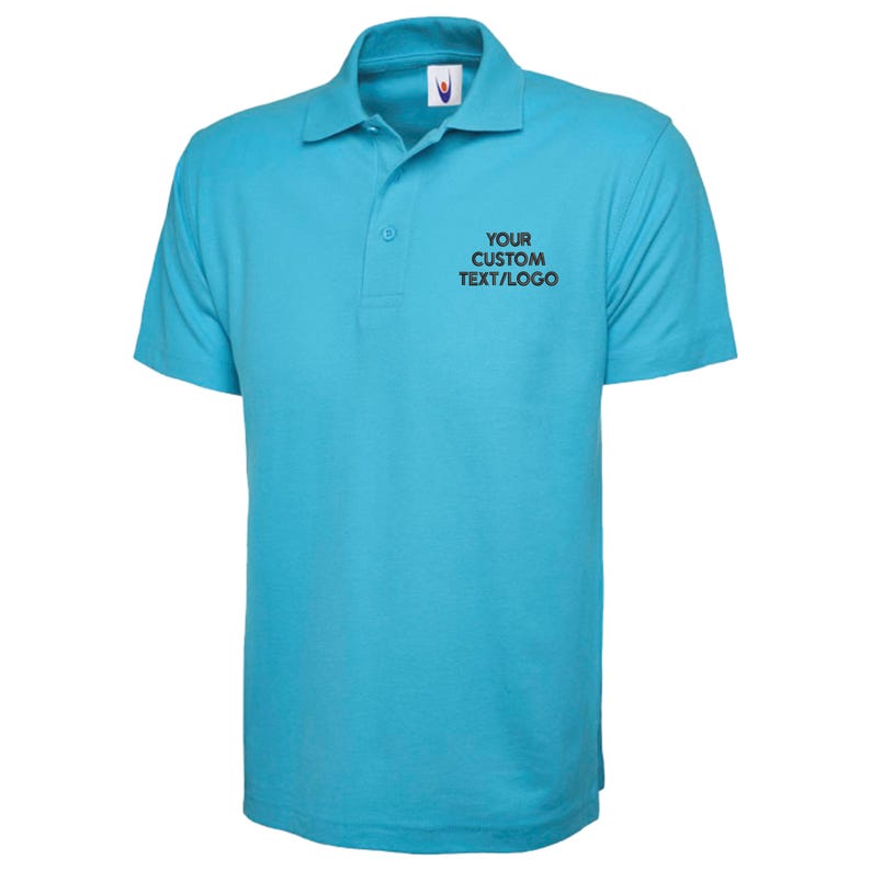 May include: A turquoise polo shirt with short sleeves and a collared neckline. The shirt features a three-button placket and the text "YOUR CUSTOM TEXT/LOGO" printed on the chest. The shirt is made of a soft, breathable fabric.