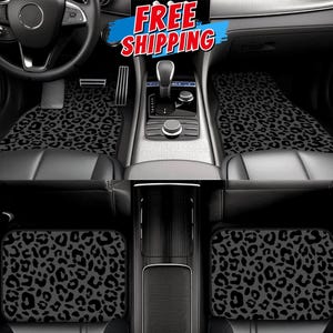 May include: A set of car floor mats featuring a repeating black and gray leopard print pattern. The mats are shown installed in the front and rear footwells of a vehicle interior, covering the floor area beneath the seats and dashboard.