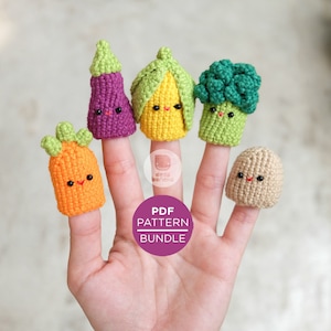 May include: A set of five finger puppets featuring a purple eggplant, a yellow corn, a green broccoli, an orange carrot, and a tan mushroom. Each puppet has a cute, smiling face. The puppets are made of crocheted yarn and are perfect for imaginative play.