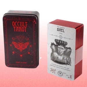 May include: A tarot card deck and matching tin. The tin is dark red with the words "OCCULT TAROT" and a moth illustration. The deck of cards has red edges and features the Emperor Bael card with text and illustrations.