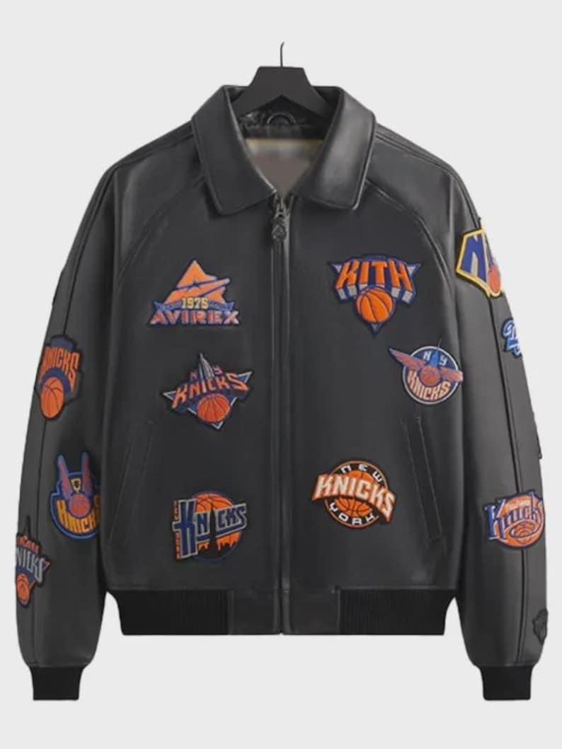 May include: A black leather jacket featuring a collared neckline, a front zipper closure, and ribbed cuffs and hem. The jacket is decorated with multiple embroidered patches, including Kith and New York Knicks basketball team logos in orange, blue, and white.