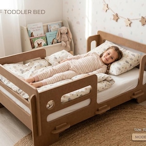 May include: A light brown MDF toddler bed with side safety rails and a low-profile frame. The bed features a rectangular design with rounded cutouts. Text on the image reads MDF TODDLER BED, Size: 156x95 cm, and MODEL 102A. The bed includes a mattress.