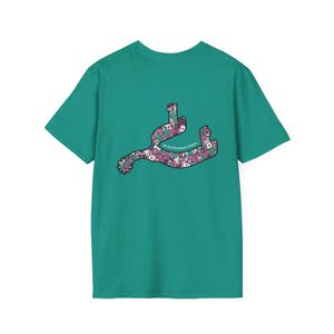 May include: Teal t-shirt featuring a floral spur design. The spur is filled with pink, purple, and white floral patterns. The text "MS Performance Paints" is printed on the spur. The shirt is a short-sleeved crew neck.