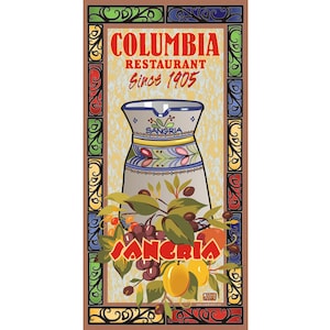 May include: A vintage-style poster for Columbia Restaurant, established in 1905. It features a decorative pitcher with the word "Sangria" and illustrations of fruit and foliage. The poster has a decorative border with the restaurant's name.