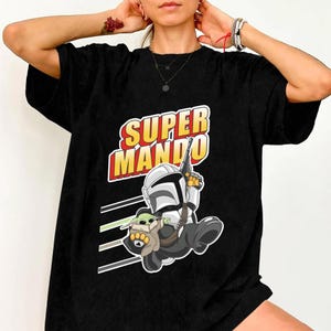 StarWars The Mandalorian And Grogu Shirt, The Mandalorian & Grogu 2026 Shirt, The Mandalorian Comfort Colors Shirt, Grogu Lovers Shirt Gift image 2