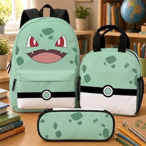 May include: A light green backpack, lunch bag, and pencil case set featuring a character face with red eyes and a wide mouth on the backpack, and a black and white horizontal stripe design with a circular emblem on the lunch bag and pencil case.