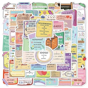May include: A selection of colourful stickers featuring motivational quotes and affirmations. The stickers vary in shape and size, with handwritten fonts and illustrations. Themes include self-care, daily reminders, and positive thinking.