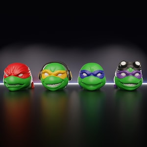 May include: Four green turtle heads with different colored masks: red, yellow, blue, and purple. One turtle head wears headphones, and another wears goggles. The heads have white teeth and are set against a dark background.