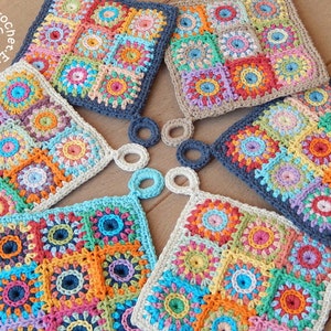 May include: Six colorful crocheted pot holders with a circular design. The pot holders are arranged in a circle with the handles facing outward. The pot holders are made with different colors of yarn, including red, orange, yellow, green, blue, and purple. The pot holders are all the same size and shape.