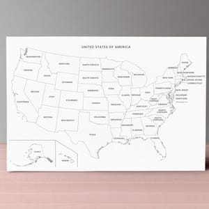 May include: A black and white map of the United States of America, with each state outlined and labeled. The title "UNITED STATES OF AMERICA" is printed at the top. The map includes Alaska and Hawaii. The map is displayed on a white background.