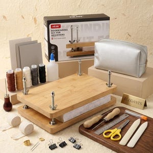 May include: A bookbinding kit for beginners, featuring a wooden book press, tools, thread, and a silver cosmetic bag. The kit includes a variety of supplies for crafting and bookmaking projects. The box reads "HEJIN BOOKBINDING KIT FOR BEGINNERS".