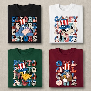 May include: Four t-shirts in black, white, dark green, and maroon, each featuring a cartoon character wearing a patriotic top hat. The designs include Eeyore, Goofy, Pluto, and Owl, surrounded by text and icons with red, white, and blue patterns.