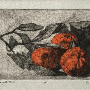 May include: An artistic print of oranges with stems and leaves. The oranges are a vibrant orange color, contrasted by the dark gray leaves and stems. The artwork is labeled "Oranges with stems" and "1/3".