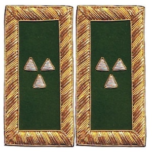 May include: A pair of rectangular shoulder boards featuring a dark green felt center bordered by intricate gold metallic embroidery. Each board displays three small, silver-toned triangular embroidered emblems arranged in a triangular pattern.