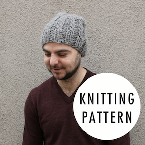 May include: A gray knitted beanie with a cable knit pattern. The beanie is being worn by a person. The text "Knitting Pattern" is on a white circle in the foreground.
