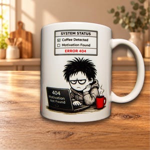 May include: A white ceramic mug featuring a graphic of a tired person at a laptop with a red mug. Above is a box labelled SYSTEM STATUS with Coffee Detected checked, Motivation Found unchecked, and the red text ERROR 404. The laptop screen reads 404 Motivation Not Found.