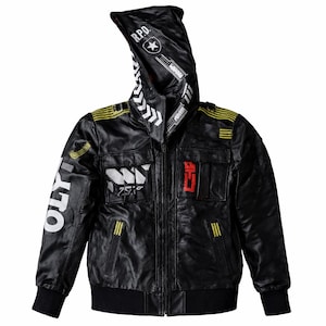 May include: Black faux leather jacket with a hood featuring white and yellow accents. The jacket has multiple patches and text, including "R.P.D." and "OLY". The design includes a zipper closure, two front pockets, and ribbed cuffs and hem.
