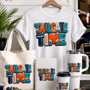 May include: A white t-shirt, a canvas tote bag, a spiral-bound notebook, a tall tumbler with a handle, and a smaller cup, all featuring the text "TAILGATE TIME" in orange, teal, and navy blue 3D-style lettering with football-themed accents.