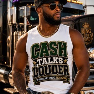 May include: A white sleeveless shirt featuring the text CASH TALKS LOUDER in green and black block letters with gold accents, and the smaller text IF YOU'RE NOT PAYING, STOP PLAYING on a banner at the bottom, worn with a black baseball cap and belt.