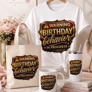 May include: A white t-shirt, a beige canvas tote bag, a white ceramic mug, and a white stainless steel tumbler, each featuring a graphic design with a yellow warning triangle and the text WARNING BIRTHDAY BEHAVIOR IN PROGRESS.
