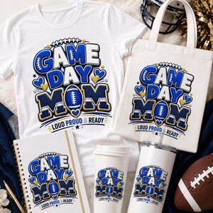 May include: A white t-shirt, a canvas tote bag, a spiral notebook, a paper cup, and a metal tumbler, all featuring a blue and gold graphic with the text "GAME DAY MOM LOUD PROUD & READY" and football icons, alongside a football and helmet.