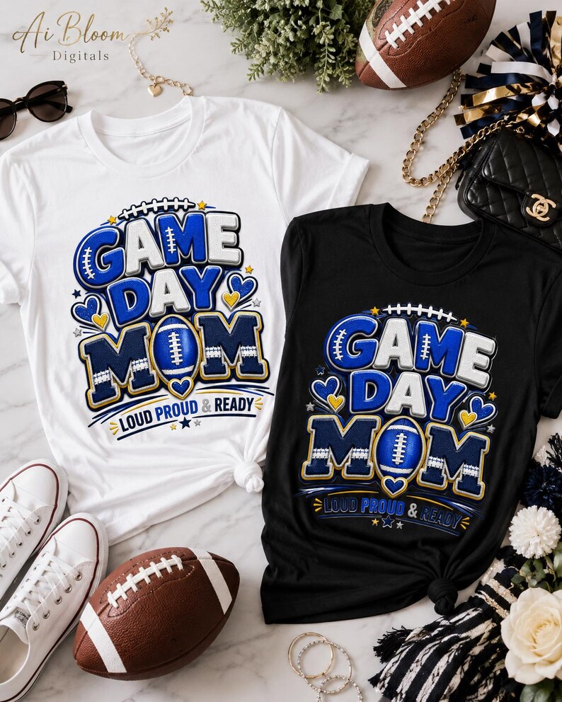 May include: A white t-shirt and a black t-shirt, each featuring a graphic design with the text "GAME DAY MOM" and "LOUD PROUD & READY" in blue, white, and gold, accented with football, heart, and star illustrations.
