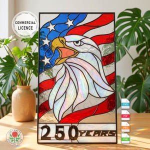 May include: Stained glass panel featuring an American bald eagle and the US flag. The eagle has a yellow beak and is set against a backdrop of red, white, and blue. The text "250 YEARS" is at the bottom. The panel is framed in black.