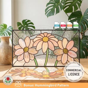 May include: A rectangular stained glass panel with a black frame, depicting three peach-coloured daisy flowers with yellow centres and green stems. The image includes the text "QG Crafts Stained Glass" and "Commercial Licence".