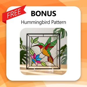 May include: A stained glass panel featuring a colorful hummingbird, flowers, and leaves. The bird has red, green, and yellow plumage. The panel is framed in black and includes the text "BONUS Hummingbird Pattern" and "FREE".