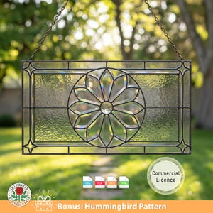 May include: Rectangular stained glass panel with a floral design in the center, framed by black lines and star accents. The panel is suspended by a chain. The image includes the text "Bonus: Hummingbird Pattern" and a logo.