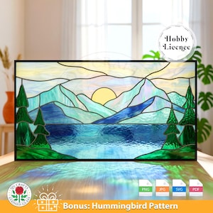 May include: Stained glass panel depicting a mountain lake scene with a setting sun. The artwork features shades of blue, green, and yellow, framed in black. Includes the text "Bonus: Hummingbird Pattern" and various file type icons.