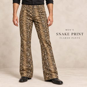 May include: Flared trousers featuring a brown and black snake print pattern. The trousers have a button closure and belt loops. Text on the right side reads: MEN'S SNAKE PRINT FLARED PANTS. The garment is paired with a black shirt and black shoes.