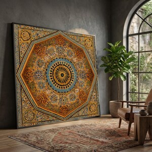 May include: A large square wall art piece featuring an intricate geometric mandala pattern in shades of gold, amber, and blue. The design is centered within a large octagon, surrounded by detailed lattice-like motifs in a dark frame.