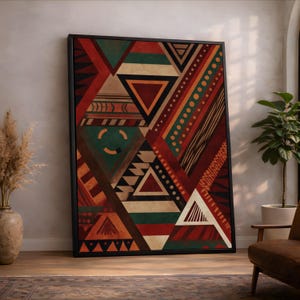 May include: A rectangular wall art piece in a black frame featuring a geometric pattern of triangles, stripes, and dots. The composition uses a color palette of deep red, forest green, black, and cream, arranged in a complex, layered abstract design.