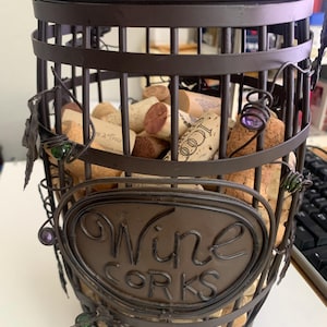 This is a metal wine cork holder (Epic Products Wine Barrel Cork Cage). It conta